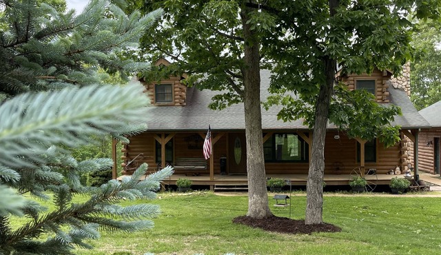 Real Log Cabin with Seasonal Pool and Hot Tub near Blue Springs Ranch