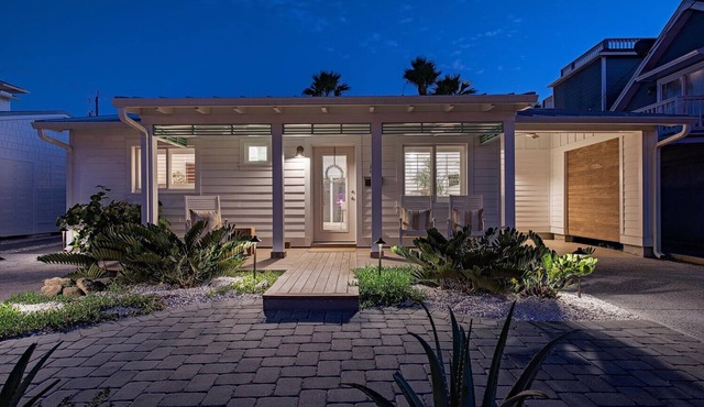 Recently Remastered Beachside Boat House STEPS from the Ocean with HEATED pool.