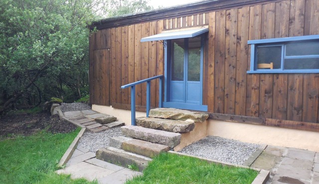 Red Cuillin Cabin on riverbank