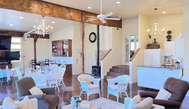 Red Roof Farmhouse has beds for 27, a 12 person swim spa, 1350 sq ft activity rm