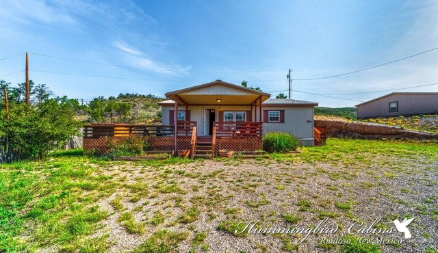 Redman! A single level, cozy cabin on a hill with a direct view of the Ruidoso Downs Racetrack!