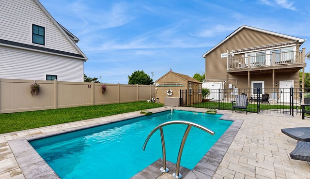 Rehoboth Beach home with private pool, patio, fenced yard, 2 fridges, & W/D