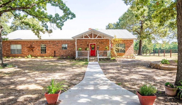 Relax and enjoy the peace & quiet at this spacious ranch on 30 plus acres.n