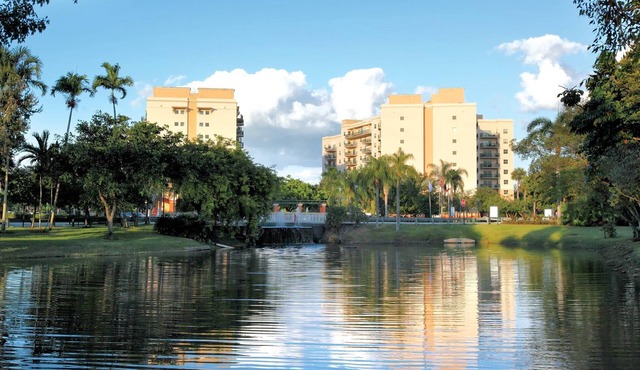 Relax at our Palm Tree secluded Resort with a poolside bar and waterslide