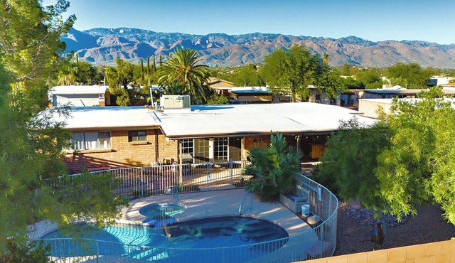Relax at Sonoran Gem Escape-your private desert retreat with a sparkling pool, soothing spa, and mountain views.