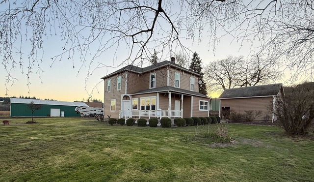 Relax at Stephens Legacy Farmhouse, a spacious 4BR retreat with valley and mountain views