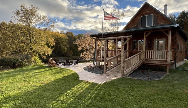 Relax at The Lincoln Log Cabin perched along the Jump River.
