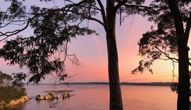 Relax at this cliff top retreat overlooking Long Beach.