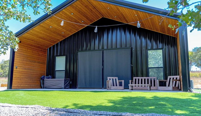 Relax at this Modern Rustic Barndominium in Nocona. This 2BR, 2BA retreat offers an open layout, chef’s kitchen, spa-style baths, and outdoor patio with fire pit—perfect for families, couples, or friends under the Texas stars.
