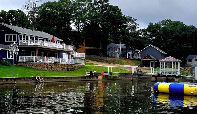 Relax by Lake of the Ozarks in your spacious Sunrise Beach retreat on 1 acre.