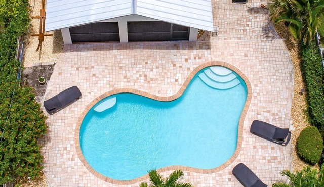 Relax by the sand at nearby Vanderbilt Beach or hang by heated pool
