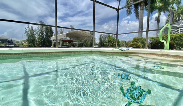 Relax! Canal Home, Sunsets, Heated Pool, Lanai with TV, Boat Dock, Gulf Access