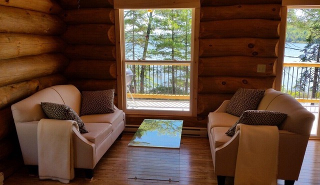 Relax in Canada: a lakeside log cottage near Kejimkujik National Park.