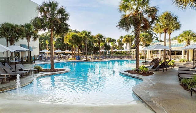 Relax in Comfort! 4 Spacious Units, Balcony, Pool, & Beachfront Location!