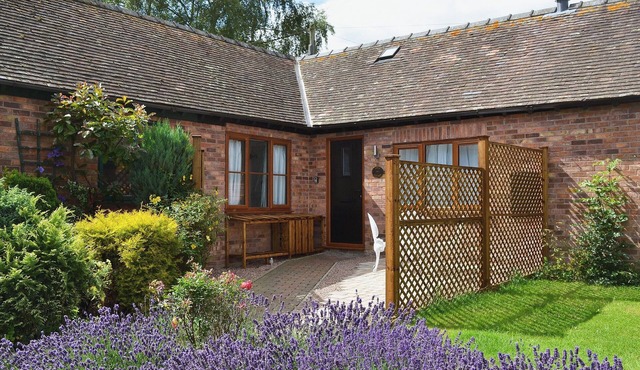 Relax in front of the woodburner in this single-storey barn conversion.