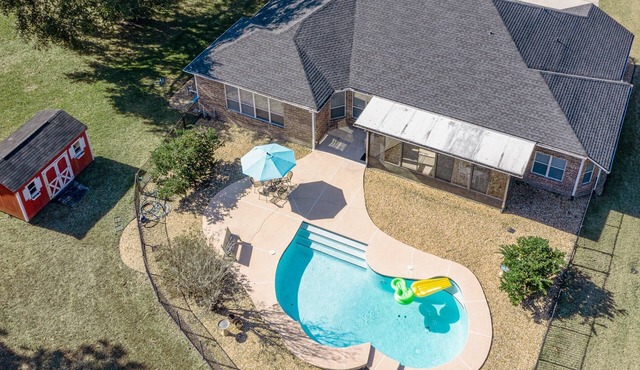 Relax in our cozy 3 BR home with a spacious master suite with soaking tub, large yard, pool, BBQ