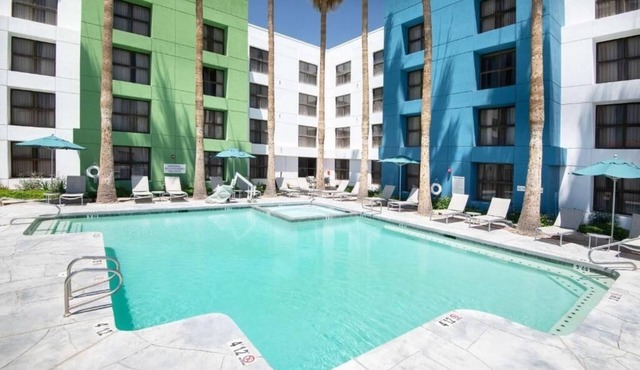 Relax in Our Eco-Certified Room with Pool, Fitness, Dining, and I‑10 Convenience