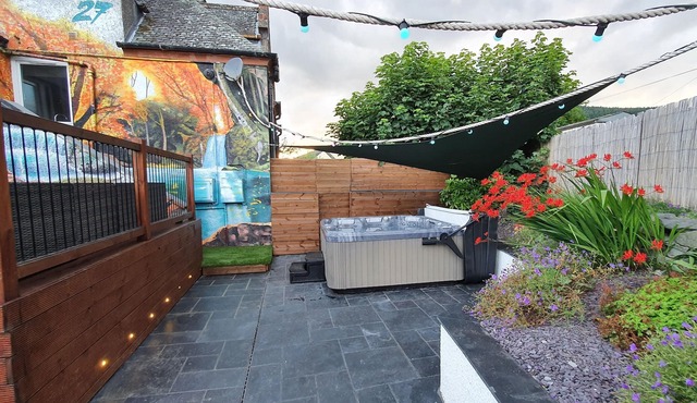 Relax in this luxury renovated flat with a hot tub and log burner