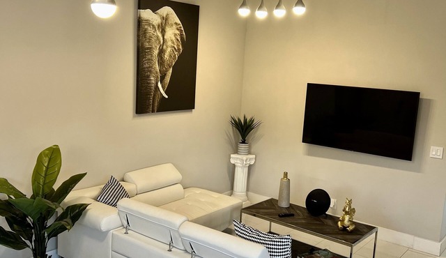 Relax in this Modern 2 Bedroom Home Close to Shopping and Highway