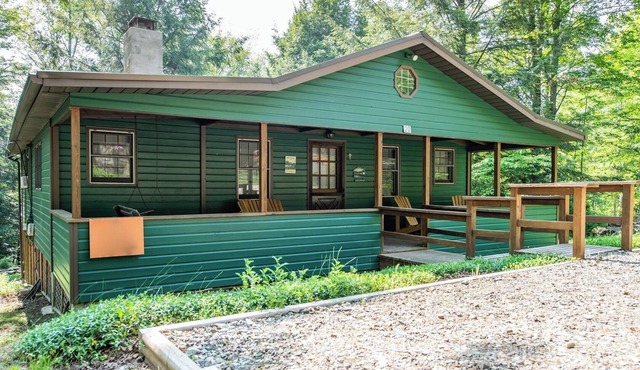 Relax on the covered porch at "J.C.'s Bunkhouse" at Lake Mokoma