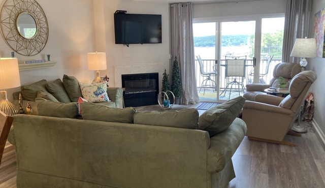 Relax on your screened in balcony overlooking the Lake. Two Golf Courses nearby.