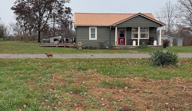 Relax & step back to Grandma’s house. 4 BR Farmhouse updated with style.