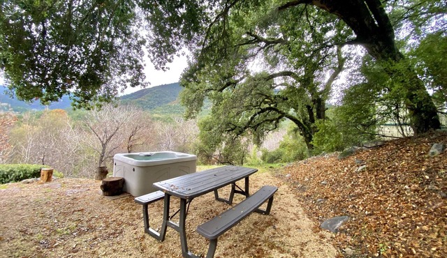 Relax to the Sound of the River while you soak in a Private Hot Tub