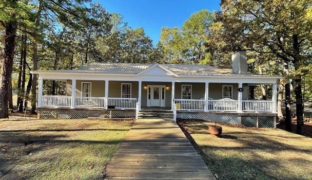 Relax & Unwind in this Vaulted-Ceiling Cabin with Fireplace, Full Kitchen & Lake Views