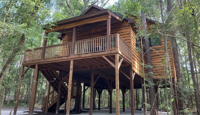 Relax with a view from above in a tree-top getaway! Two Creeks Crossing Resort