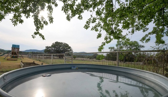 Relax with Hill Country Views! Stock tank POOL and great backyard!