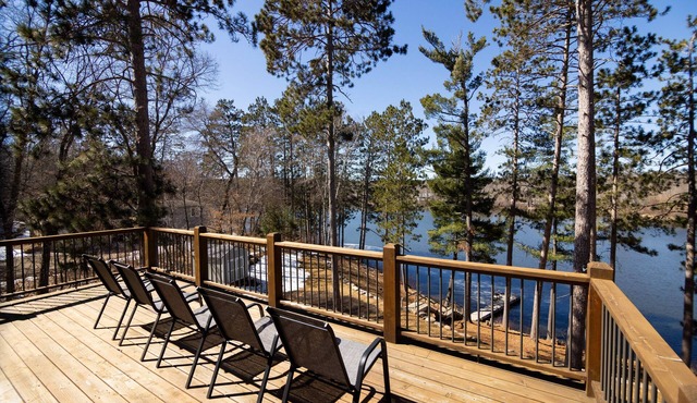 Relaxing retreat on Rice Lake! Quiet lake views w/full deck, fire pit, & hot tub