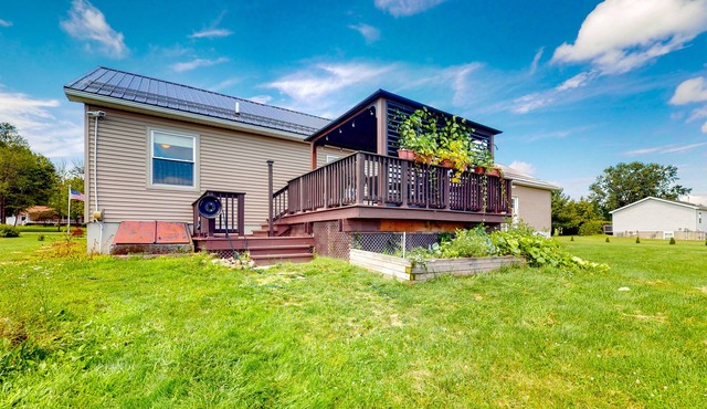Relaxing two-story home with a deck, firepit, game room, & washer/dryer