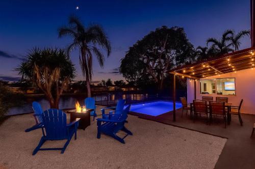 Relaxing Waterfront 3BR 2BA with Pool Fire Pit BBQ Hammock Tree Swing