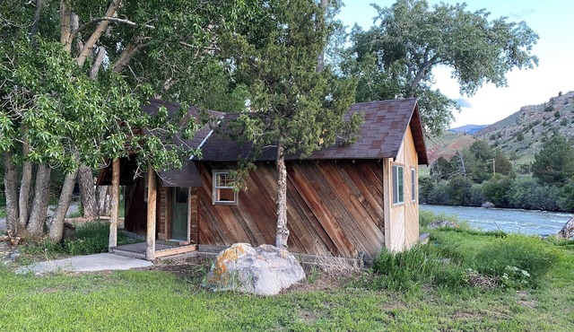 Remodeled Cabin on 40 private acres of Wind River frontage with R/V hookup.n