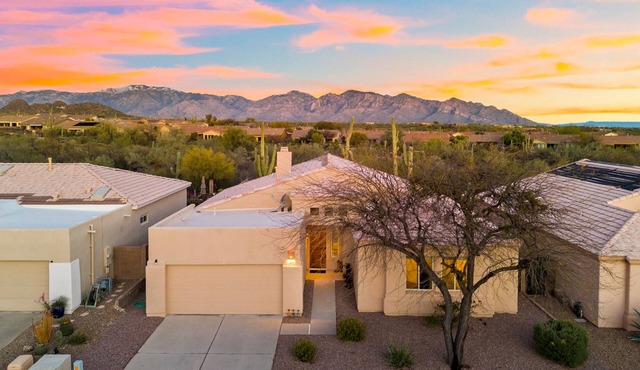 Remodeled modern beauty backs to open desert with mountain views & home theatre