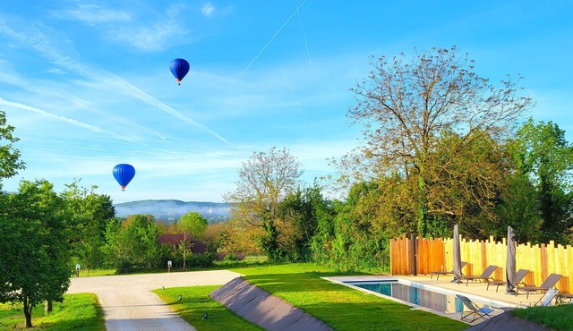 Renovated loft-style tobacco drying shed with private heated pool near Sarlat