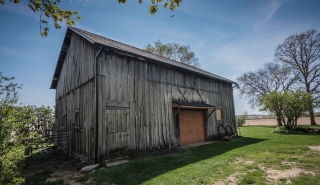 Renovated 1921 vintage farmhouse with barn on one acre of land.