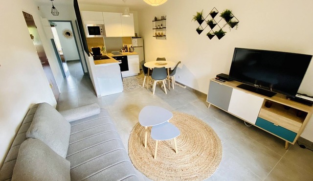 Renovated 2-room apartment with balcony and private parking