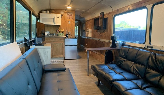 Renovated coach bus overlooking equestrian and plantation properties.