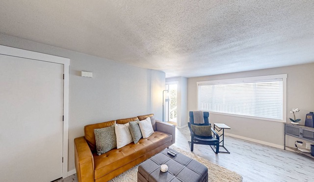 Renovated condo with covered porch, grill, & private washer/dryer