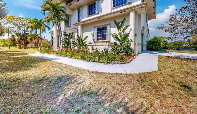 Renovated, elegant retreat with a fitness room, work desks, large deck, & W/D