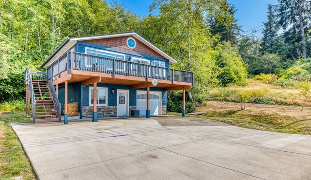 Renovated home with wood stove, water views, & expansive balcony - dog ok