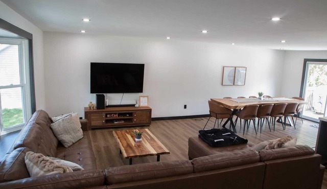 Renovated open concept family sized Home with game room and fire pit in backyard