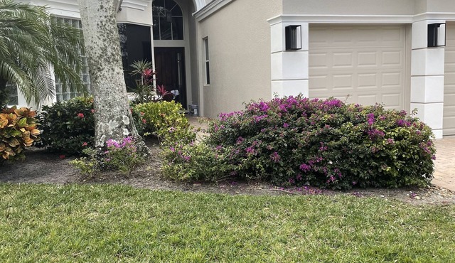 Renovated open floor plan with large heated pool and screened lanai with dining.
