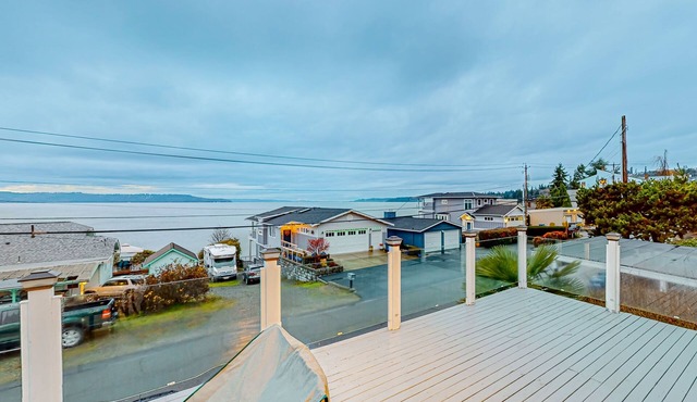 Renovated sound & mountain view home with open layout, grill, & washer/dryer