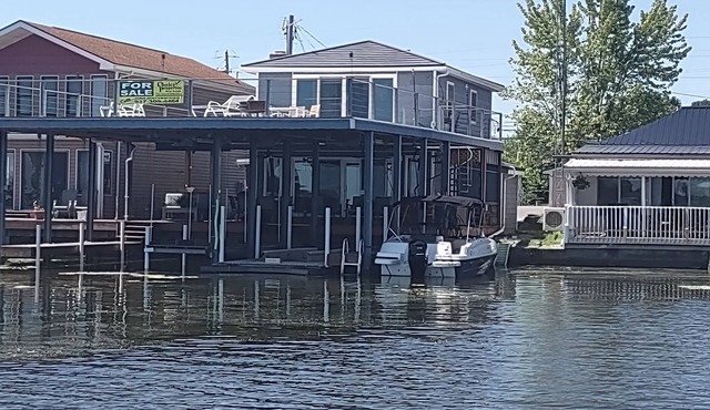 Renovated Waterfront House with MASSIVE boat house and party deck