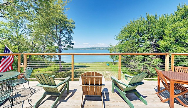 Renovated waterfront cottage with expansive deck, multiple fireplaces, & grill