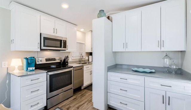 Resort Living in this fully remodeled park home in Carriage Manor