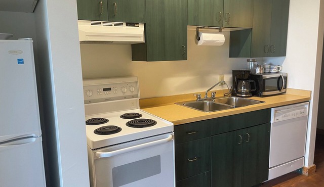 Resort room with two beds and a full kitchen and hottub access