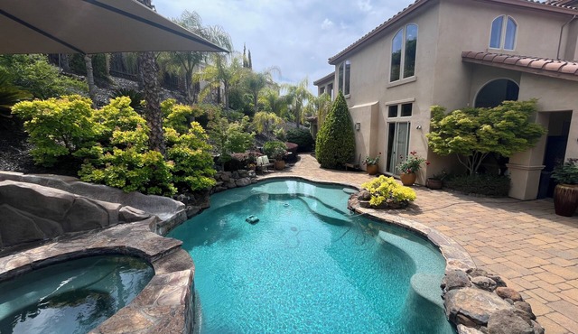 Resort style 4 bedroom home in Hillcrest gated community with pool and spa